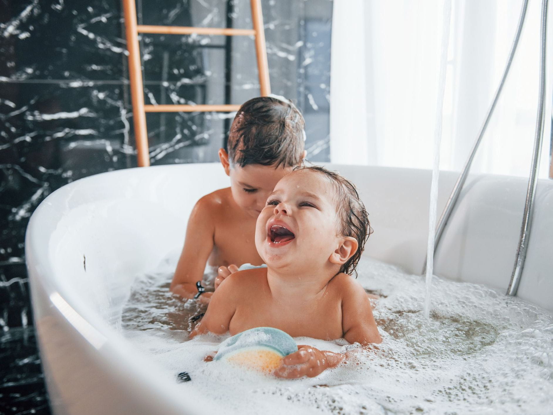 two kids in tub