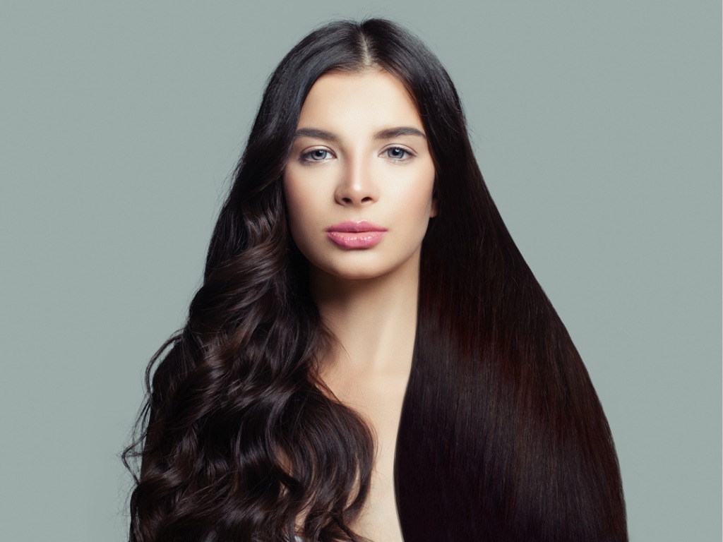 woman with half straightened half curly hair